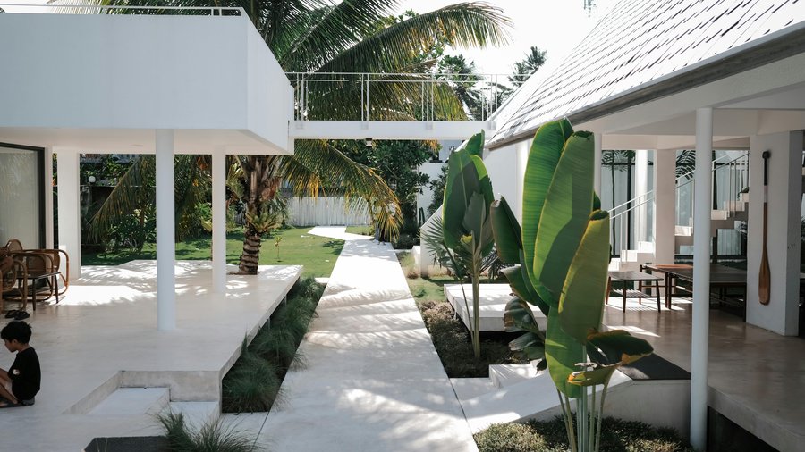 Elara Hills courtyard villa — tropical modern architecture with open walkways and garden